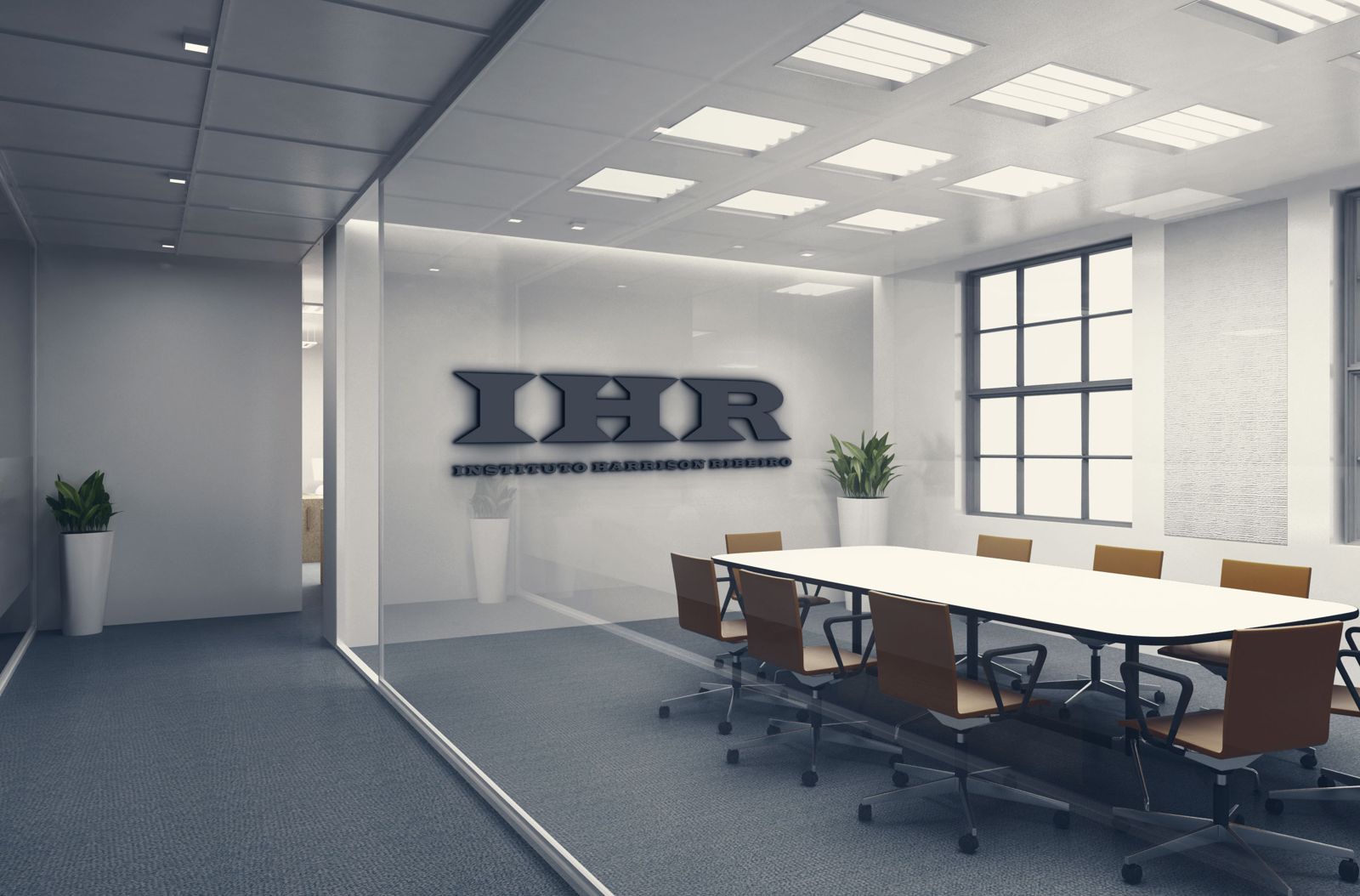Sala de reuniões com o logotipo do Instituto Harrison Ribeiro na parede de vidro